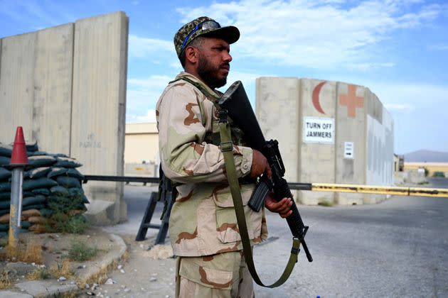 An Afghan National Army (ANA) soldier stands guard at a gate of a hospital inside the Bagram US air base after all US and NATO troops left (Photo: WAKIL KOHSAR via Getty Images)