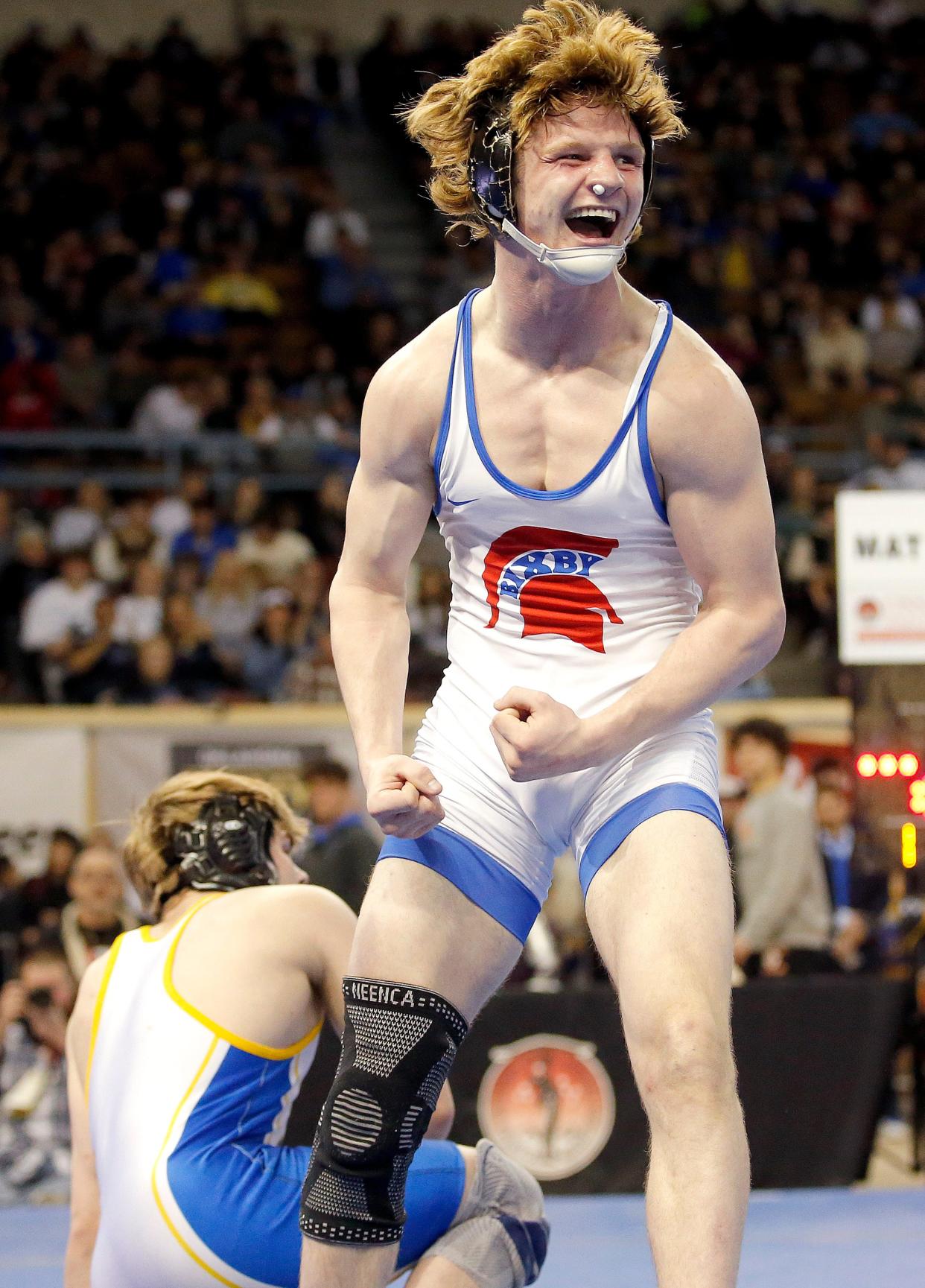 Bixby's Clay Giddens-Buttram celebrates after beating Stillwater's Kael Voinovich in the Class 6A 150-pound match during the Oklahoma state wrestling championships at State Fair Arena in Oklahoma City, Saturday, Feb.25, 2023. 