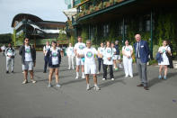 Mayor of London Sadiq Khan (centre) stands with Chairman Ian Hewitt (second from right) and keyworkers from the All England Lawn Tennis Club in Wimbledon, south west London, during an event to thank members of the NHS, TfL and care workers for their service during the coronavirus pandemic.