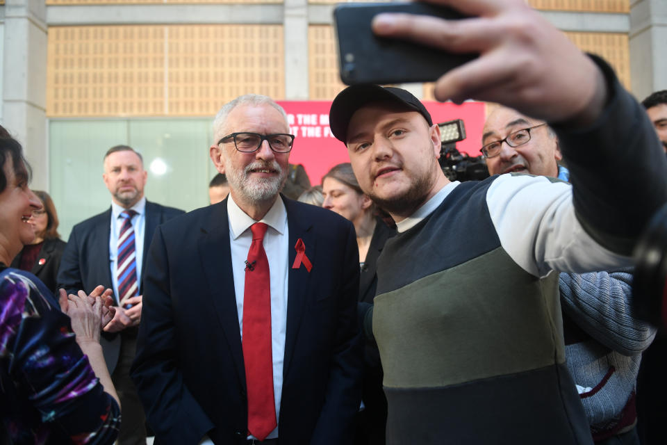 Labour leader Jeremy Corbyn takes a selfie with a supporter following a speech on international and foreign policy in York, while on the General Election campaign trail.