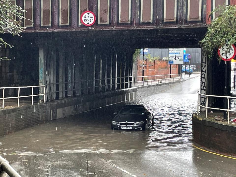 A car stuck in floodwater in Sheffield (PA)