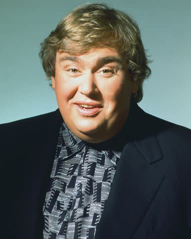<p>Harry Langdon/Getty Images</p> John Candy poses for a photo session on April 12, 1993