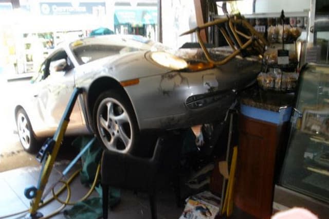 BEST QUALITY AVAILABLE Photo taken with permission from the Twitter feed of @Bucksfire of a Porsche which crashed through the window of  Caffe Nero in Gerrards Cross, Buckinghamshire. PRESS ASSOCIATION Photo. Issue date: Saturday May 16, 2015. The driver had to be treated for minor injuries. See PA story ACCIDENT Porsche. Photo credit should read: @Bucksfire/PA WireNOTE TO EDITORS: This handout photo may only be used in for editorial reporting purposes for the contemporaneous illustration of events, things or the people in the image or facts mentioned in the caption. Reuse of the picture may require further permission from the copyright holder.