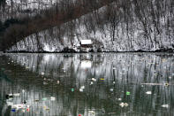 Plastic bottles float at the Potpecko accumulation lake near Priboj, in southwest Serbia, Friday, Jan. 22, 2021. Serbia and other Balkan nations are virtually drowning in communal waste after decades of neglect and lack of efficient waste-management policies in the countries aspiring to join the European Union. (AP Photo/Darko Vojinovic)