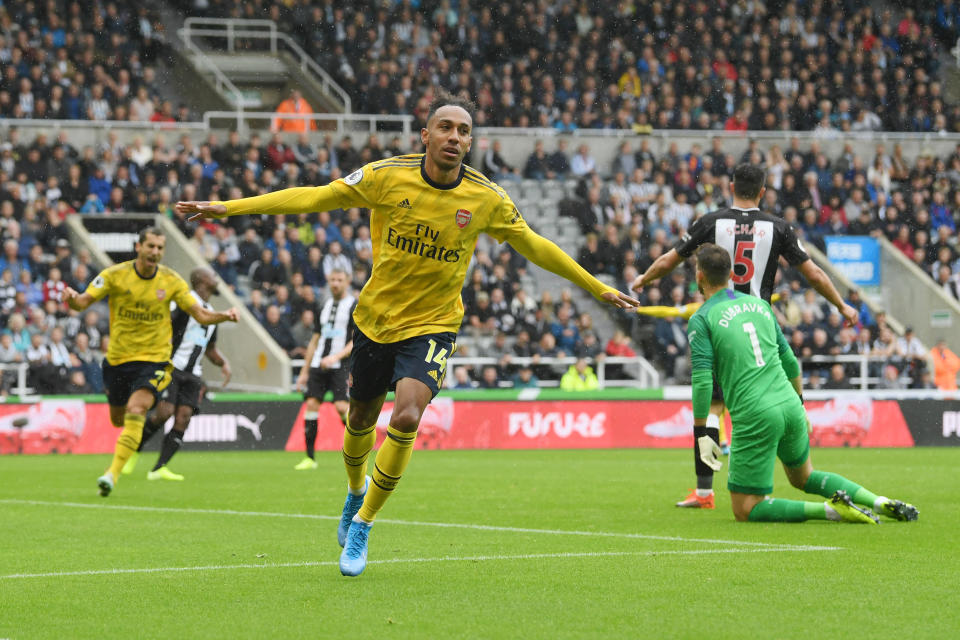 NEWCASTLE UPON TYNE, ENGLAND - AUGUST 11: Pierre-Emerick Aubameyang of Arsenal celebrates after scoring his team's first goal during the Premier League match between Newcastle United and Arsenal FC at St. James Park on August 11, 2019 in Newcastle upon Tyne, United Kingdom. (Photo by Stu Forster/Getty Images)