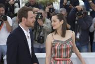 Cast members Marion Cotillard (R) and Michael Fassbender pose during a photocall for the film "Macbeth" in competition at the 68th Cannes Film Festival in Cannes, southern France, May 23, 2015. REUTERS/Yves Herman