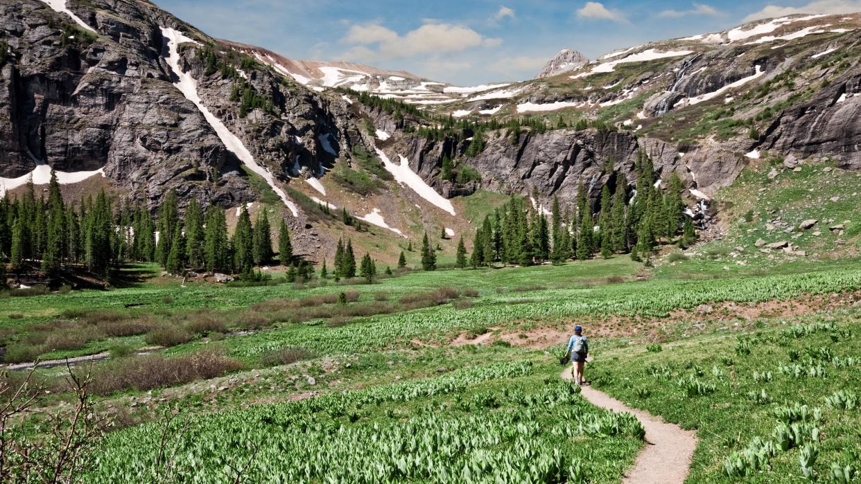  Woman Hiking to Upper Ice Lakes Basin. 