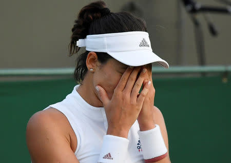 Tennis - Wimbledon - All England Lawn Tennis and Croquet Club, London, Britain - July 5, 2018. Spain's Garbine Muguruza reacts during her second round match against Belgium's Alison Van Uytvanck. REUTERS/Toby Melville