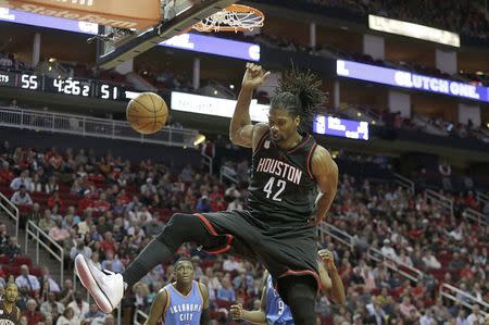 Jan 5, 2017; Houston, TX, USA; Houston Rockets center Nene Hilario (42) dunks on the Oklahoma City Thunder in the second quarter at Toyota Center. Thomas B. Shea-USA TODAY Sports