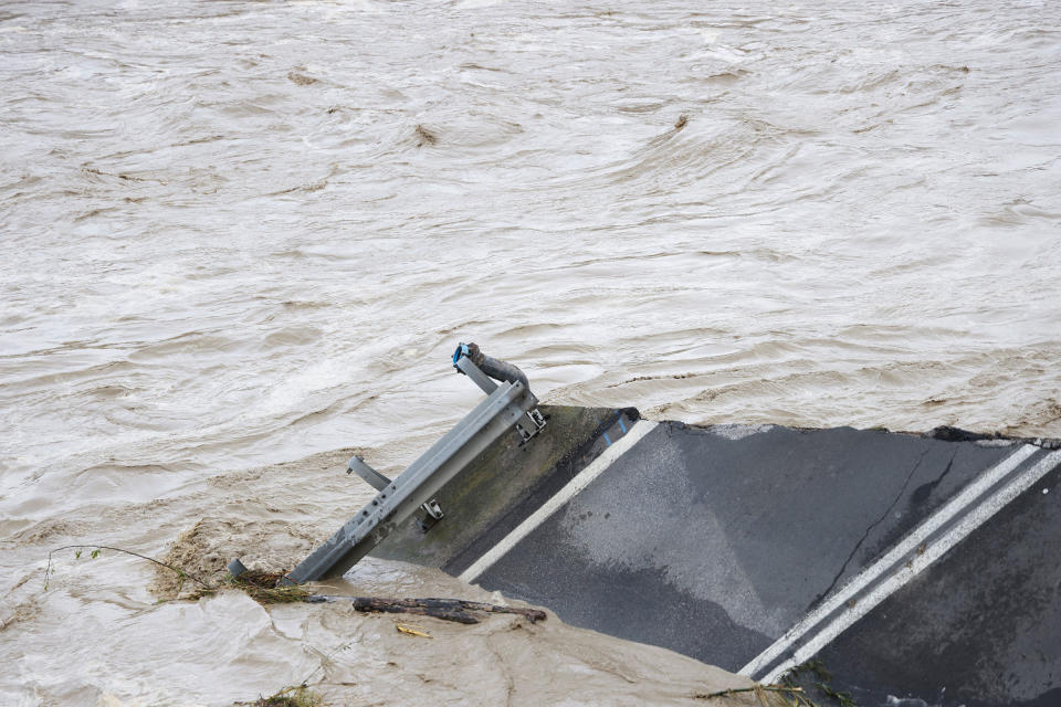 A collapsed bridge can be seen in the aftermath of a heavy rain that hit Italy's northern Emilia-Romagna region, in Budrio near Bologna, on May 17.<span class="copyright">Claudia Greco—Reuters</span>
