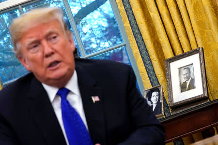 U.S. President Donald Trump takes questions from Reuters journalists during an exclusive interview in the Oval Office at the White House in Washington, U.S. December 11, 2018. REUTERS/Jonathan Ernst