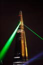 LONDON, ENGLAND - JULY 05: Laser lights shine from The Shard over Tower Bridge on July 5, 2012 in London, England. (Photo by Matthew Lloyd/Getty Images)