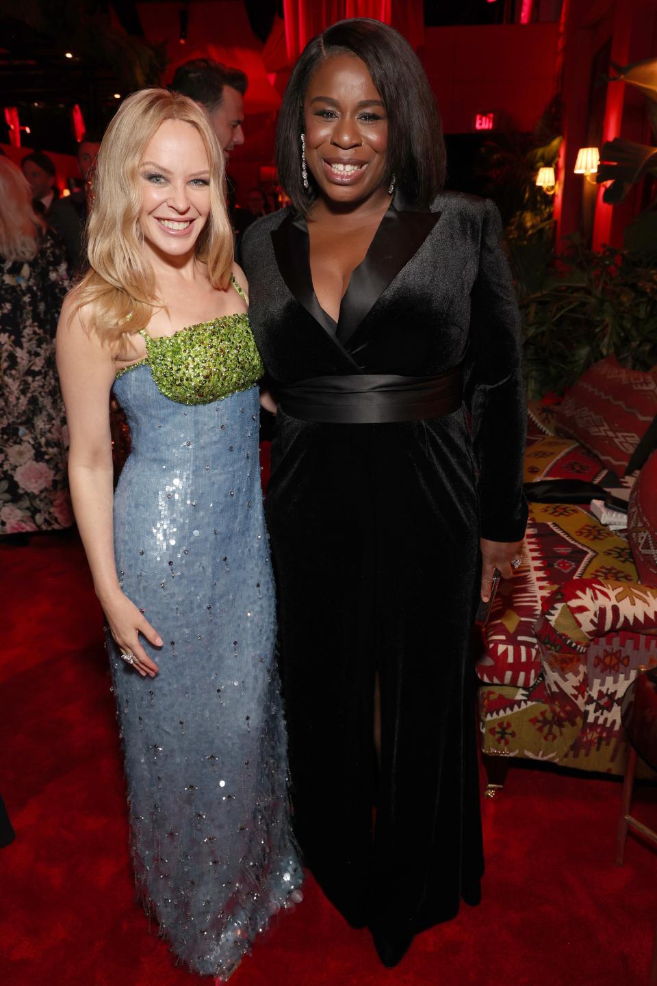 Image may contain: Uzo Aduba, Kylie Minogue, Fashion, Adult, Person, Premiere, Wedding, Clothing, Dress, Chair, and Furniture