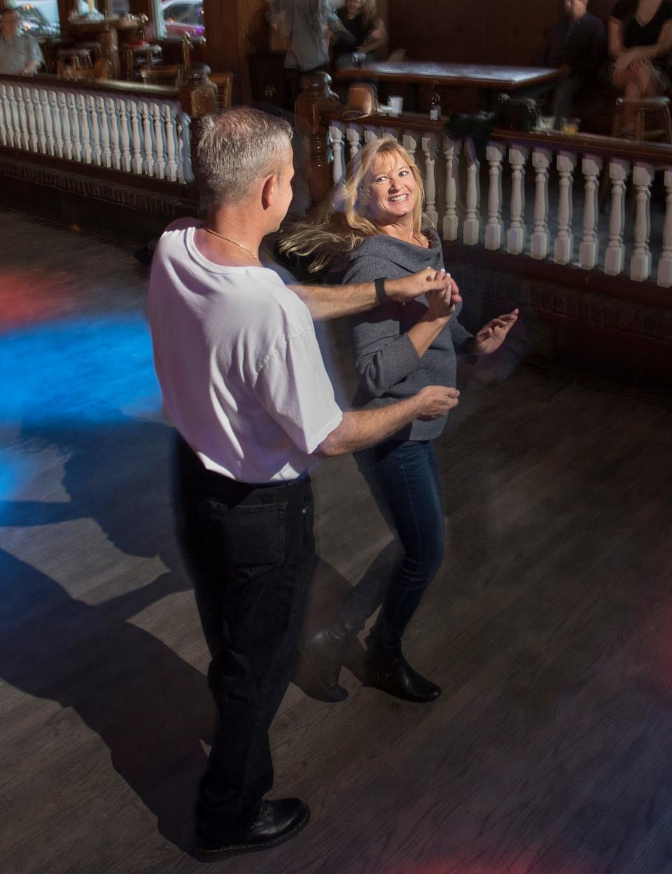 Angela Ballard and Steve Myers practice their moves during the weekly Latin Dance night at Seville Quarter in Pensacola on Wednesday, April 4, 2018. Their moves will come in handy during the Salsa Music Festival July 29 at Community Maritime Park.