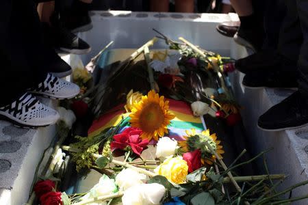 Family and friends attend the funeral of Angel Candelario, one of the victims of the shooting at the Pulse night club in Orlando, at his hometown of Guanica, Puerto Rico, June 18, 2016. REUTERS/Alvin Baez