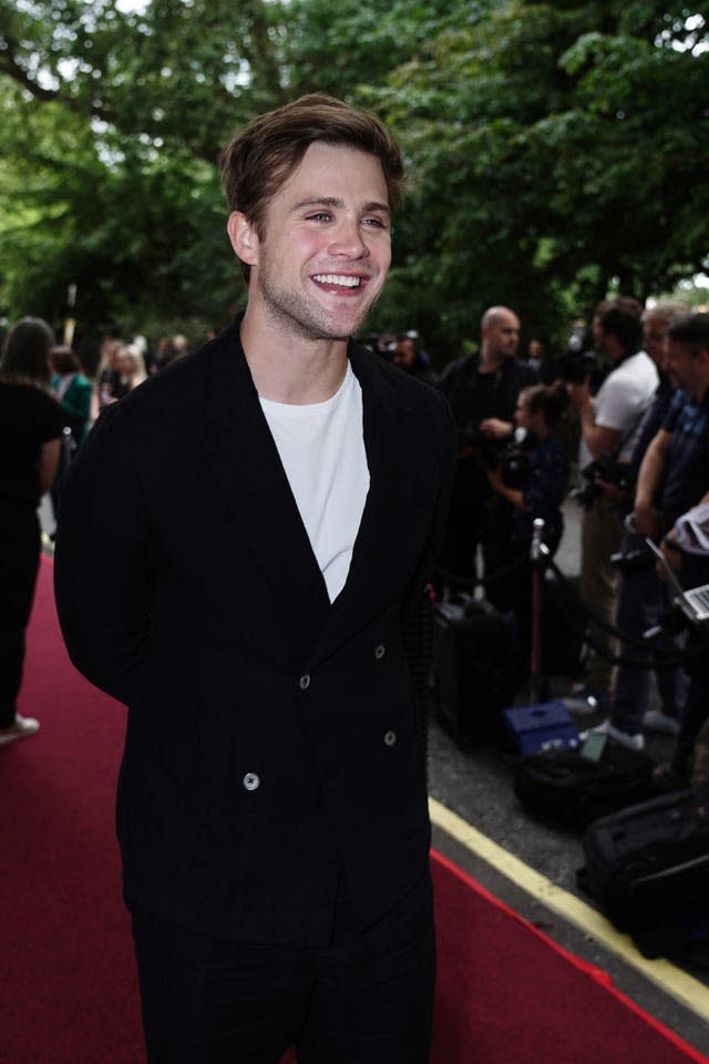 A young man with white T-shirt and dark jacket