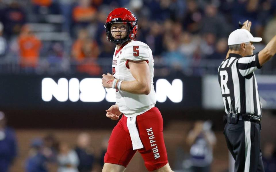 N.C. State quarterback Brennan Armstrong (5) heads off the field after throwing an interception during the first half of N.C. State’s game against Virginia at Scott Stadium in Charlottesville, Va., Friday, Sept. 22, 2023.