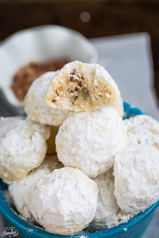 <p>Life Made Sweeter</p><p>Classic Pecan Snowball Cookies are the perfect classic treat for your holiday cookie platter. They are buttery, melt in your mouth shortbread like cookies with chopped pecans. </p><p>Get the recipe: <a href="http://lifemadesweeter.com/2013/12/classic-pecan-snowball-cookies/" rel="nofollow noopener" target="_blank" data-ylk="slk:Classic Pecan Snowball Cookie;elm:context_link;itc:0;sec:content-canvas" class="link rapid-noclick-resp"><strong>Classic Pecan Snowball Cookie</strong></a></p>