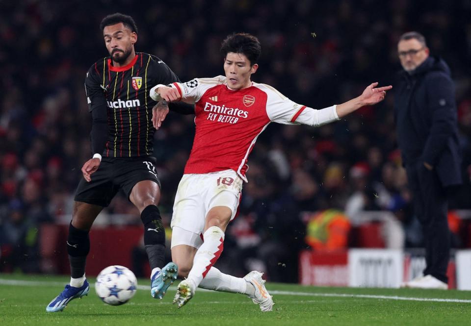 Takehiro Tomiyasu battles for the ball in the Champions League against Lens (REUTERS)