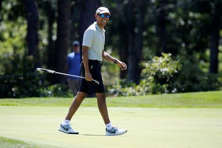 FILE PHOTO: U.S. President Barack Obama smiles after putting on the first green at Farm Neck Golf Club during his annual summer vacation on Martha's Vineyard, in Oak Bluffs, Massachusetts, U.S. August 7, 2016. REUTERS/Jonathan Ernst/File Photo