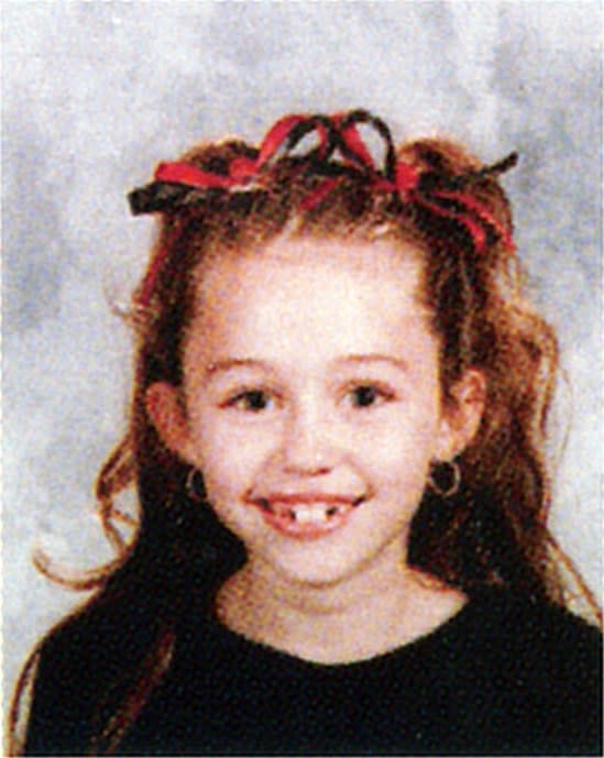 We are SCREAMING about this photo of Miley Cyrus in the 3rd grade. The hair. The teeth. The big grin that gave her that nickname in the first place. This was a face destined for stardom.
