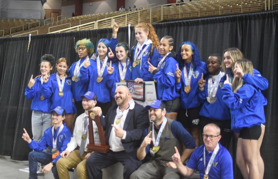 Matanzas wrestlers and coaches revel in their team title Saturday, March 4, 2023, at the FHSAA State Wrestling Championships at the Silver Spurs Arena in Kissimmee. Matanzas won its first title with 124 points, 17 more than second-place Orlando Freedom.