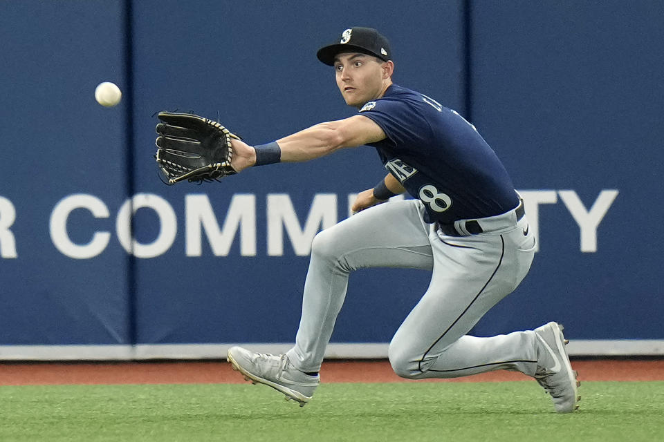 Seattle Mariners left fielder Dominic Canzone makes a catch on a fly out by Tampa Bay Rays' Josh Lowe (8) during the fifth inning of a baseball game Friday, Sept. 8, 2023, in St. Petersburg, Fla. (AP Photo/Chris O'Meara)