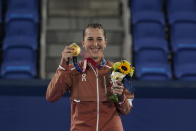 Belinda Bencic, of Switzerland, poses with the gold medal in the women's singles of the tennis competition at the 2020 Summer Olympics, Sunday, Aug. 1, 2021, in Tokyo, Japan. (AP Photo/Seth Wenig)