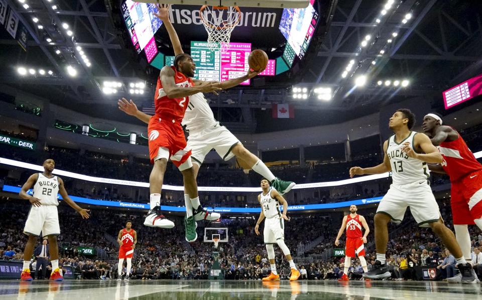 Toronto Raptors' Kawhi Leonard shoots past Milwaukee Bucks' Brook Lopez during the second half of Game 5 of the NBA Eastern Conference basketball playoff finals Thursday, May 23, 2019, in Milwaukee. The Raptors won 105-99 to take a 3-2 lead in the series. (AP Photo/Morry Gash)