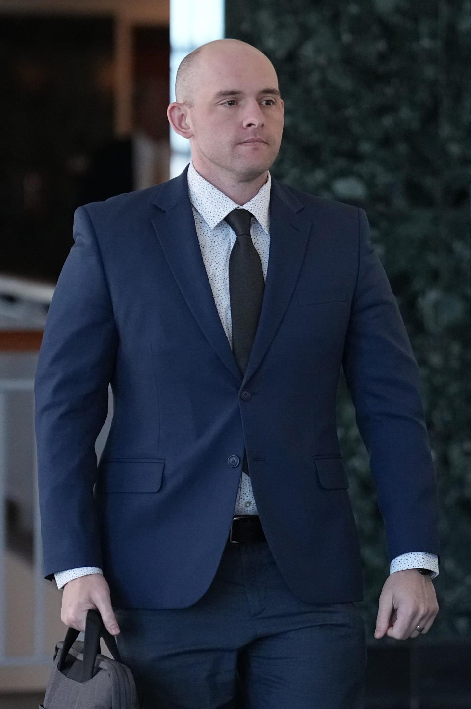 Defendant Jason Rosenblatt walks into the Adams County Justice Center for the start of the Elijah McClain trial Wednesday, Sept. 20, 2023, in Brighton, Colo. The trial is expected to open soon against two police officers charged in the 2019 death of Elijah McClain, a Black man who was forcibly detained while walking down a street near Denver. (AP Photo/Jack Dempsey)