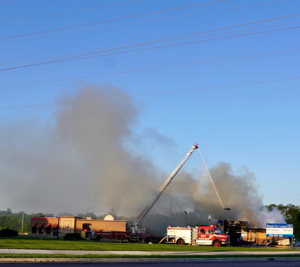 Minneapolis awoke Saturday to the smell of burning rubber and plastic after overnight protests. Firefighters poured water onto a still-smoldering gas station in the Hiawatha area.