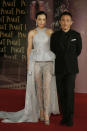 Hong Kong actor Tony Leung, right poses with his wife actress Carina Lau on the red carpet of the 33rd Hong Kong Film Awards in Hong Kong Sunday, April 13, 2014. (AP Photo/Vincent Yu)