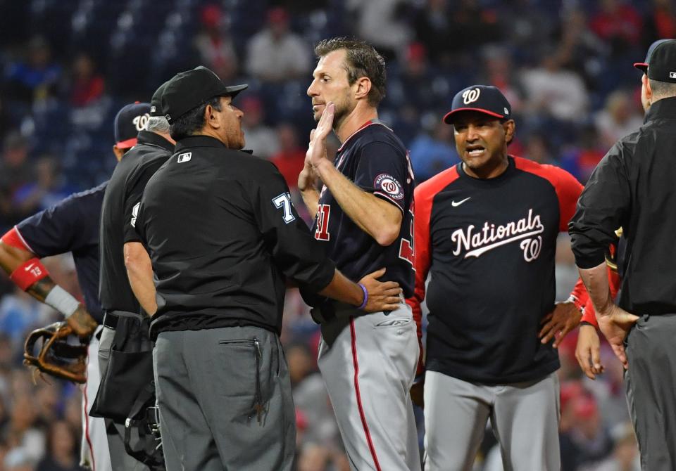 Nationals ace Max Scherzer and manager Dave Martinez discuss the pitcher's third check of the game for illegal substances by umpire Alfonso Marquez.