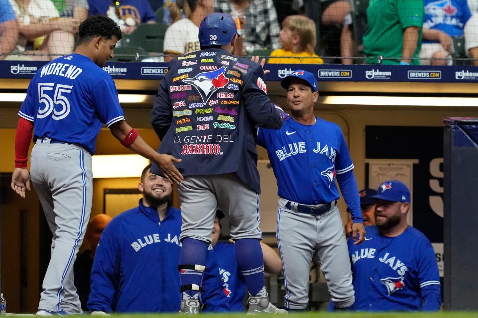 Alejandro Kirk of the Toronto Blue Jays celebrates with the Blue Jacket after hitting a two-run home run against the Milwaukee Brewers in the seventh inning at American Family Field on Friday.