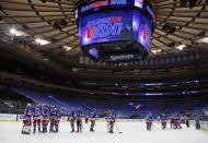 The New York Rangers celebrate a win over the New York Islanders in an NHL hockey game Saturday, Jan. 16, 2021, in New York. (Bruce Bennett/Pool Photo via AP)