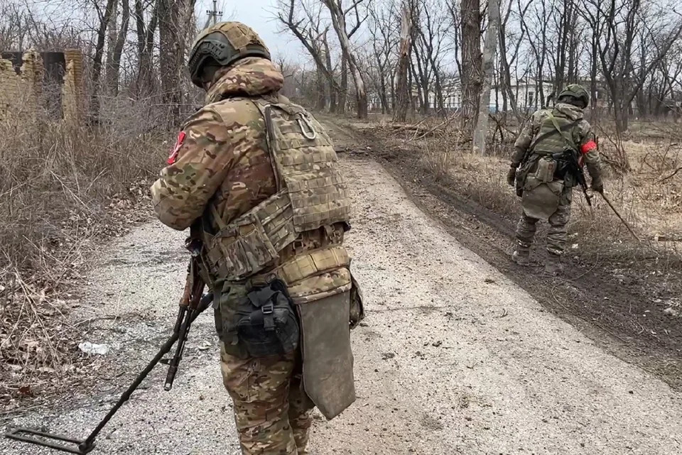 In this photo released by Russian Defense Ministry Press Service on Monday, Feb. 19, 2024, Two soldiers of the Russian military engineering units eliminate the mine danger in the city of Avdiivka, eastern Ukraine. Russian forces have taken complete control of the Ukrainian city of Avdiivka. (Russian Defense Ministry Press Service via AP)