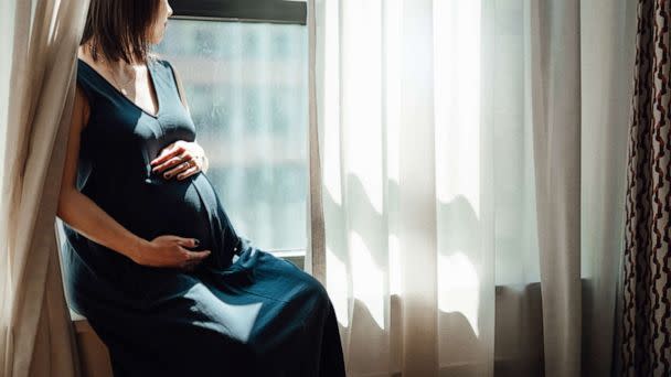 PHOTO: A pregnant woman sits by a window in an undated stock image. (STOCK PHOTO/Oscar Wong/Getty Images)