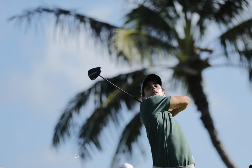 Joaquin Niemann, of Chile, follows through on his shot from the 14th tee box during the first round of the Sony Open golf tournament Thursday, Jan. 14, 2021, at Waialae Country Club in Honolulu. (AP Photo/Jamm Aquino)