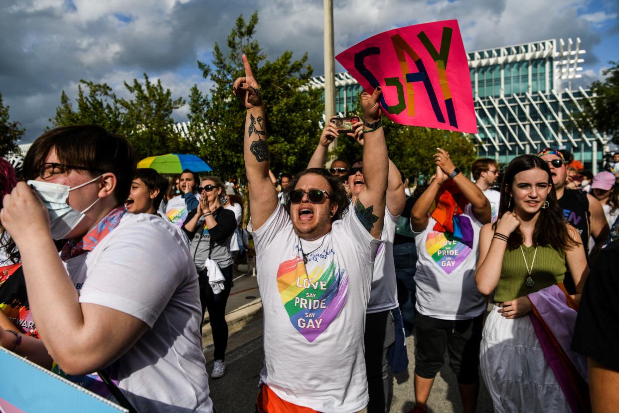 Members and supporters of the LGBTQ community attend a rally in Miami Beach, Fla., on March 13, 2022