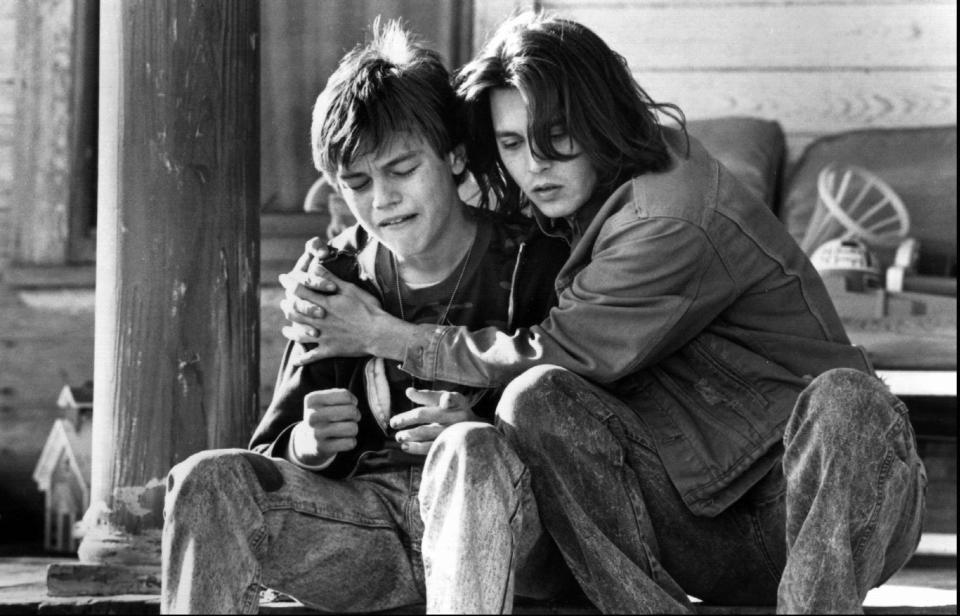 Leonardo DiCaprio (left) plays the mentally impaired younger brother of Johnny Depp's caring title character in"What's Eating Gilbert Grape."