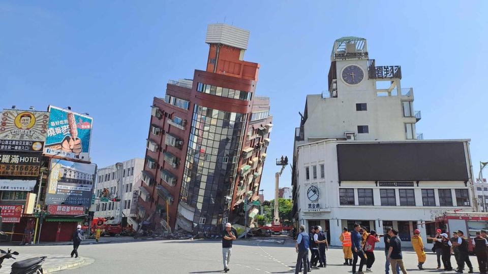 A red building is partially collapsed after a powerful 7.3-magnitude earthquake rocked Taiwan (VCG via Getty Images)