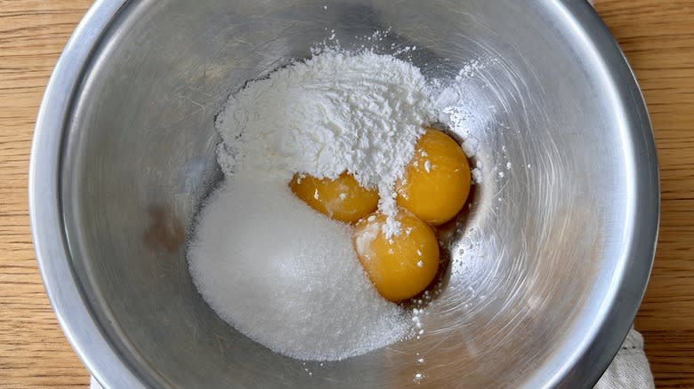 Egg yolks, sugar, and cornstarch in bowl