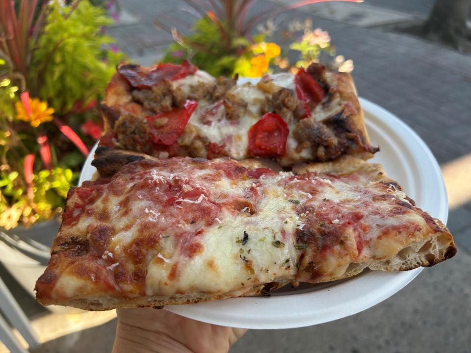 Americana (front) and sausage, pepper and onion slices from Qua Pizza in Manasquan.