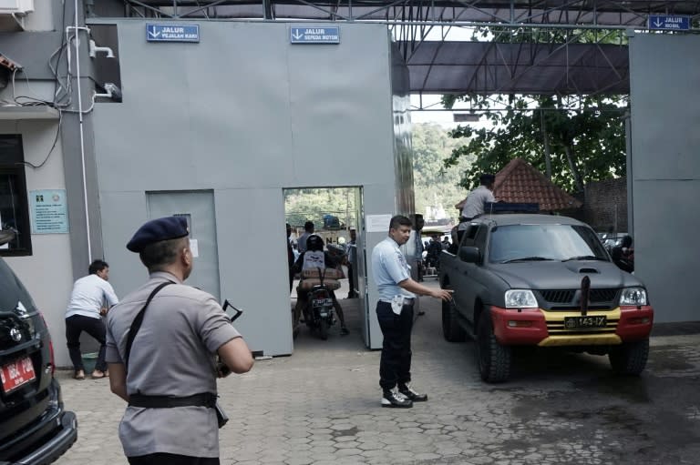 Policemen arrive at Cilacap port on July 25, 2016, the only route to Indonesia's highest security Nusakambangan prison on Cilacap where the country conducts executions