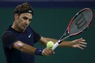 Roger Federer of Switzerland returns a shot to Albert Ramos-Vinolas of Spain during their men's singles match at the Shanghai Masters tennis tournament in Shanghai, China, October 13, 2015. REUTERS/Aly Song