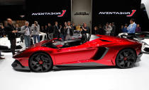 Starting with the everyday 700-hp Aventador, Lamborghini taunted the bull even further by removing the roof, adding several aerodynamic panels and generally shucking weight from a car that only had 3,472 lbs. to begin with. Even the seat fabrics have been swapped for something Lamborghini calls "Carbonskin," a fabric made from carbon fibers that's at least a decade away from being used on a teenager's hat. With no windshield, the interior has to get some form of waterproofing; the rear mirror pops up like Wall-E's head from the center of the dash. It and the roll bars behind the driver are the highest points in the car.