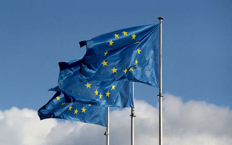 FILE PHOTO: European Union flags fly outside the EU Commission headquarters in Brussels