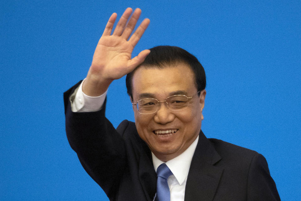 FILE - Then Chinese Premier Li Keqiang waves during a press conference after the closing session of the National People's Congress in Beijing's Great Hall of the People on March 15, 2019. Former Premier Li Keqiang, China's top economic official for a decade, died Friday, Oct. 27, 2023 of a heart attack. He was 68. (AP Photo/Ng Han Guan, File)