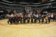 The Indiana Fever kneel during the National Anthem before the game against the Phoenix Mercury during Round One of the 2016 WNBA Playoffs on September 21, 2016 at Bankers Life Fieldhouse in Indianapolis, Indiana. (Photo by Ron Hoskins/NBAE via Getty Images)
