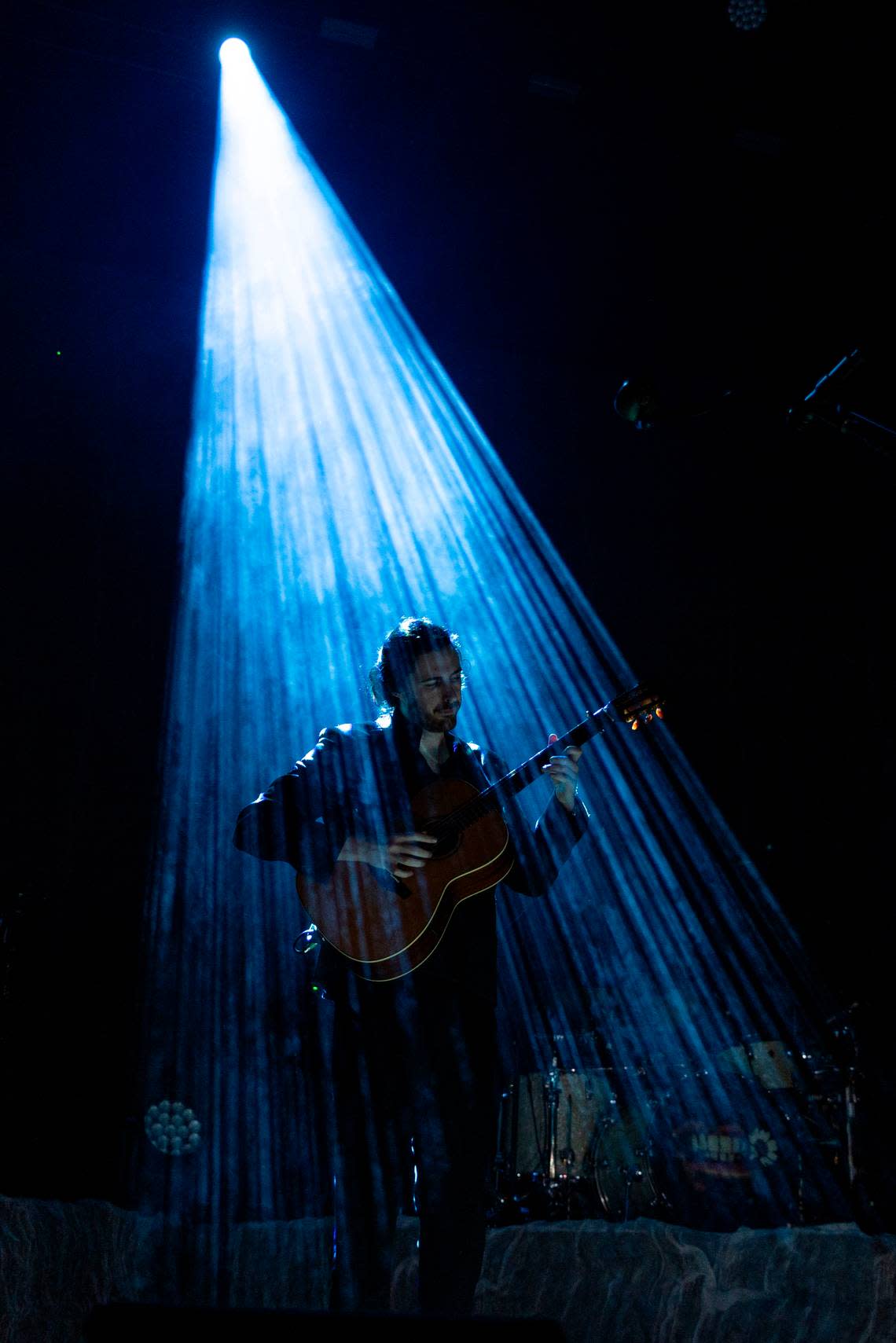 Hozier emerges from a spotlight at Coastal Credit Union Music Park at Walnut Creek in Raleigh, N.C., Saturday night, April 20, 2024.